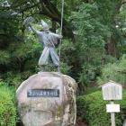 清正公石曳きの像